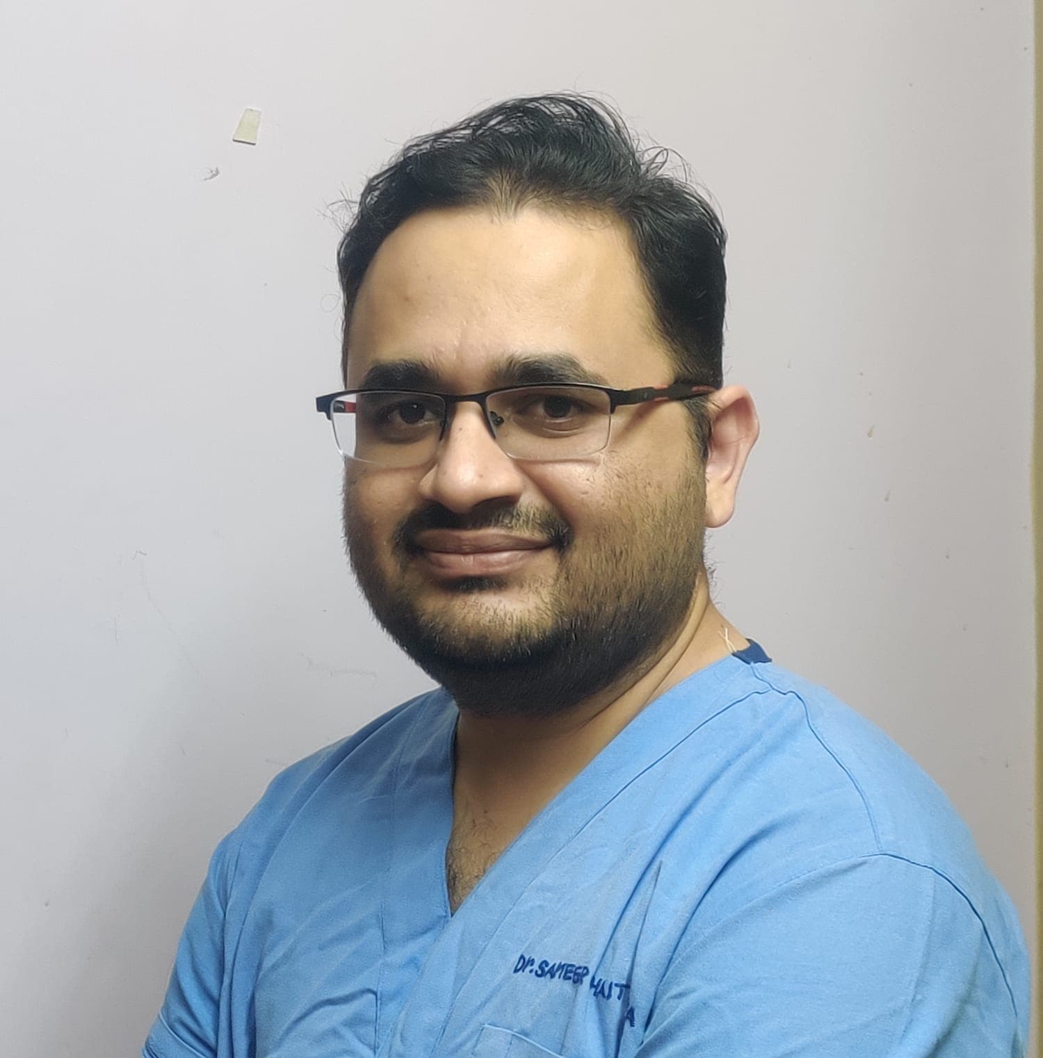 Dr. S. Sameer Chaitanya in surgical scrubs